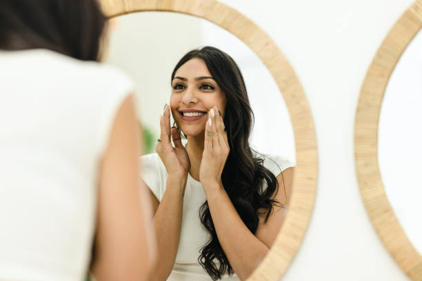 istock Young Woman Massaging Her Face 1472512540