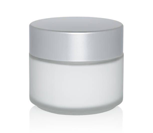 istock Glass cosmetic cream jar isolated white background 1472513587