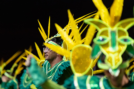 Florianópolis, Brazil - February 18, 2023: View of a members from a local samba school performing at the Carnaval parade at the sambadrome