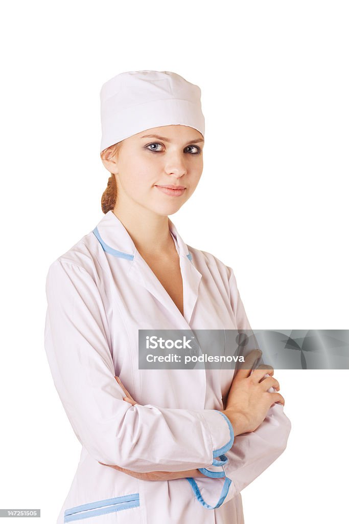 Nurse standing on white background Beautiful young nurse standing on white background Adult Stock Photo