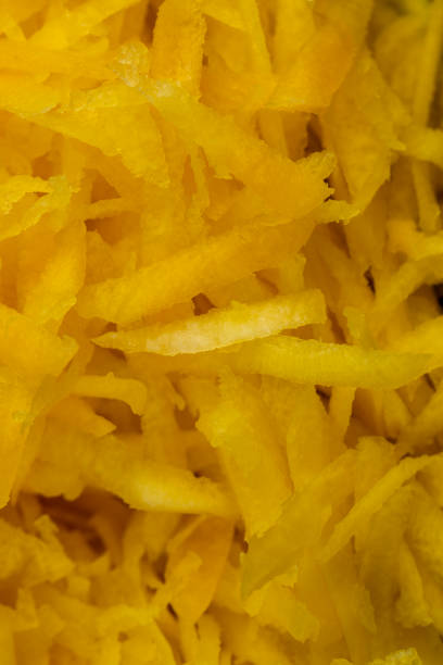 istock Sliced into thin slices of bright yellow carrots in the kitchen 1472515242