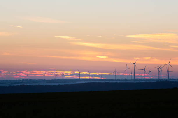 istock Wind turbines generate energy power electricity during the evening. 1472516421