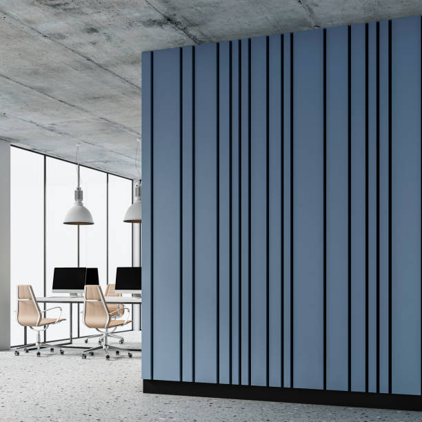 istock A side view of a semi-empty office interior with copy space and work desks on a terrazzo floor and light blue paneled wall 1472518143