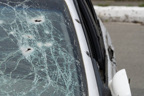 istock Abstract image of broken glass texture, background. Close-up of a broken car windshield. Broken and damaged car. 1472519629