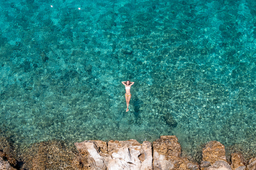 She enjoys the tropical lagoon in Croatia