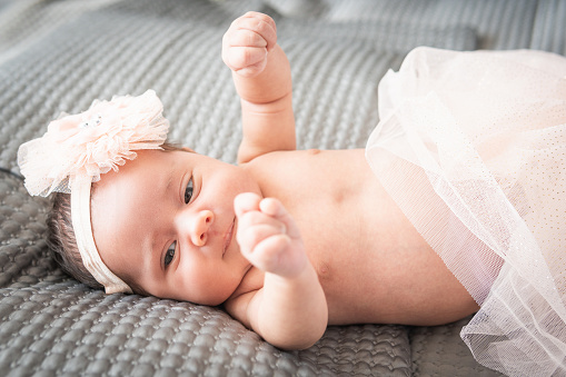 baby dressed as a ballet dancer smiling. High quality photo