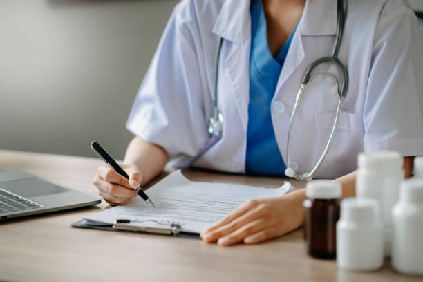 istock Medical technology concept. Doctor working with mobile phone and stethoscope and digital tablet laptop 1472523370