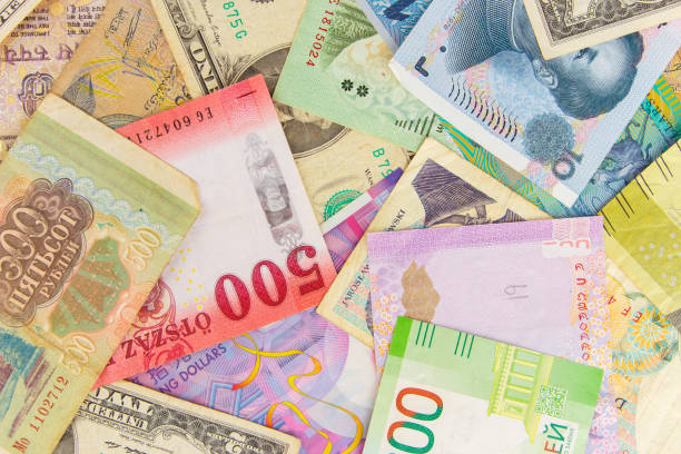istock Background from different money banknotes from all over the world 1472528532