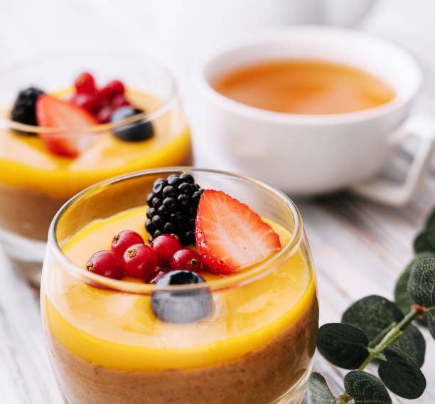 istock Delicious panna cotta with mango with berries 1472528980
