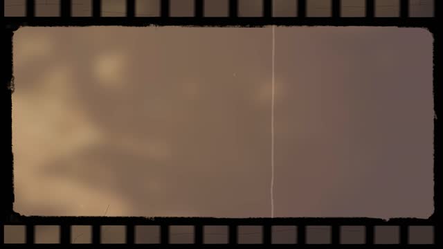 Retro vintage effect damaged film frame overlay. Dynamic rolling 16mm effect.