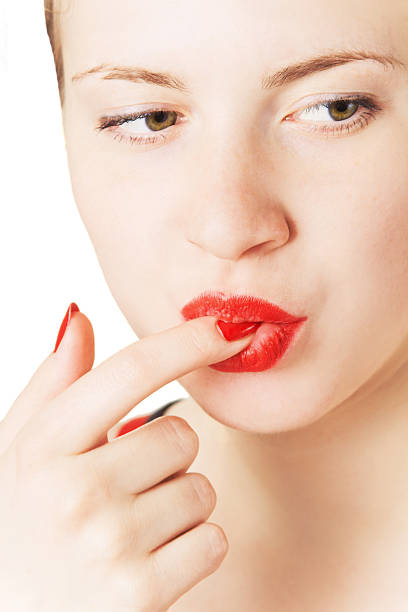 istock Girl with a finger in mouth 147253095