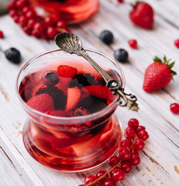 istock Jelly with fresh berries on wooden table close up 1472530978