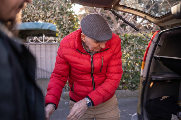 istock Active seniors taking out the grocery from the car 1472531105