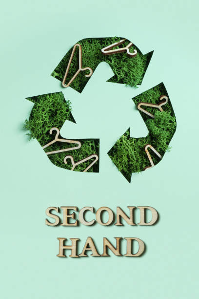 istock Second hand text and green moss under paper cut recycling symbol. Save planet, eco, recycling cloth concept 1472531829