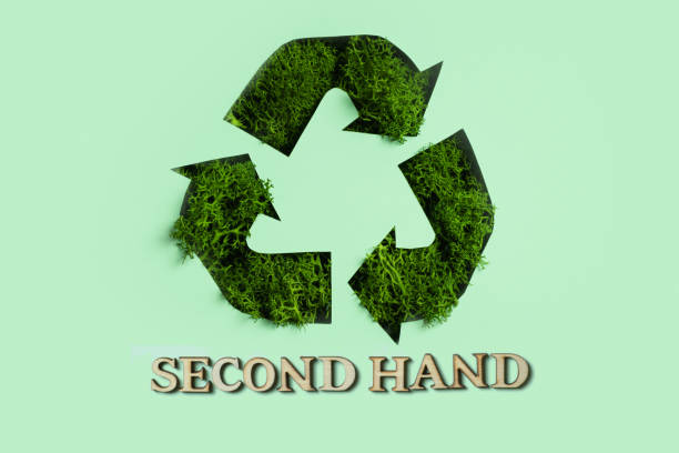 istock Second hand text and green moss under paper cut recycling symbol. Save planet, eco, recycling cloth concept 1472532051
