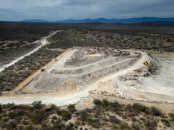 istock Drone Aerial top view large garbage pile, Garbage pile in trash dump or landfill mountain garbage 1472532636