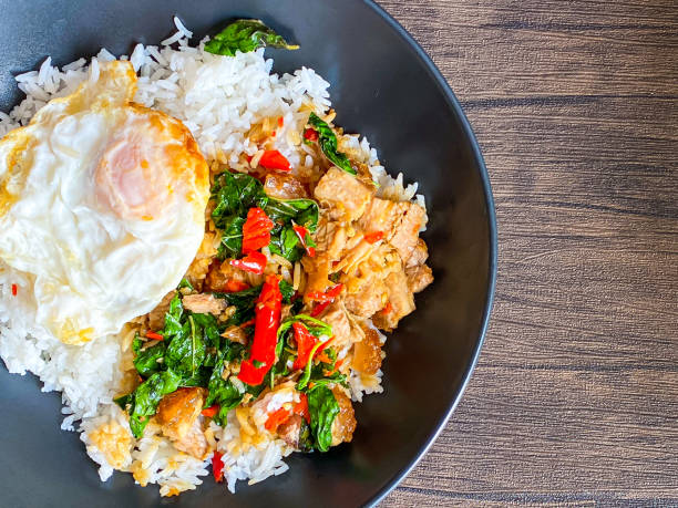 istock Rice topped with crispy pork belly with Thai basil and fried egg 1472534158