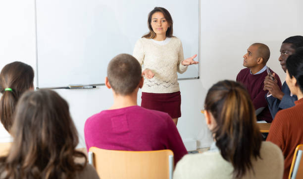 istock Female high school teacher   teaching lesson 1472534747