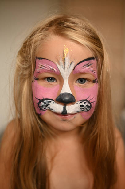istock Little girl 3 years old with a painted face. 1472536016