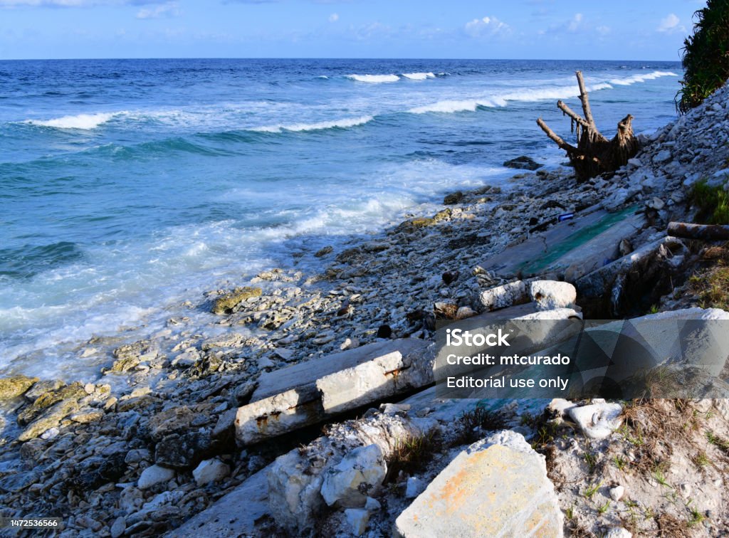 Tuvalu - Collapsed sea wall, climate change and rising sea level - Funafuti Atoll Funafuti Atoll, Tuvalu: remains of the collapsed seawall, climate change and rising sea level in the Pacific - Climate change is threatening the habitability of Tuvalu, the average height of the islands is less than 2 metres above sea level, Tuvalu Stock Photo Tuvalu - Collapsed sea wall, climate change and rising sea level - Funafuti Atoll Funafuti Atoll, Tuvalu: remains of the collapsed seawall, climate change and rising sea level in the Pacific - Climate change is threatening the habitability of Tuvalu, the average height of the islands is less than 2 metres above sea level, Tuvalu Stock Photo