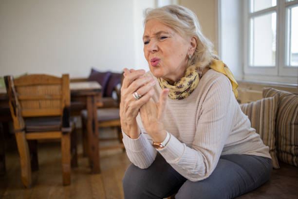 istock Senior woman suffering from pain 1472538018