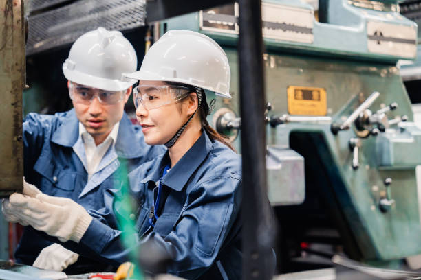 istock Technicians wearing protective goggles performing maintenance inspections on equipment 1472538398