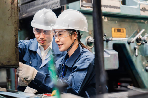 istock Technicians wearing protective goggles performing maintenance inspections on equipment 1472538401