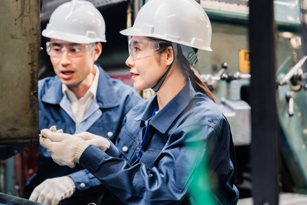 istock Technicians wearing protective goggles performing maintenance inspections on equipment 1472538411