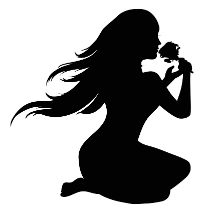 Silhouette of seated woman with long hair, holding and smelling a rose.