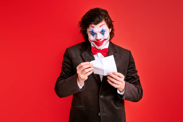Cheerful clown clapping hands with joy