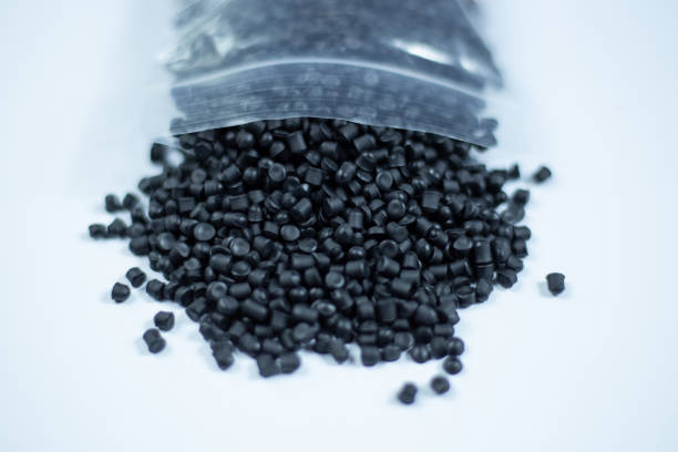 istock Black plastic pellets background. Close-up plastic granules polymer. Black plastic beads resin polymer pallet petrochemical 3d illustration. 1472539840