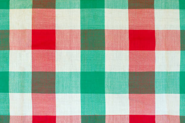 Red and green checkered tablecloth Red and green checkered tablecloth as background, closeup of photo loin cloth stock pictures, royalty-free photos & images