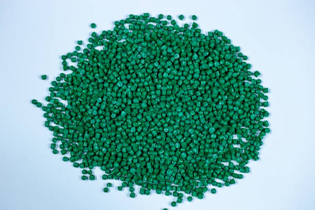 istock Dark green plastic pellets background. Close-up plastic granules polymer. Dark green plastic beads resin polymer pallet petrochemical 3d illustration. 1472540722
