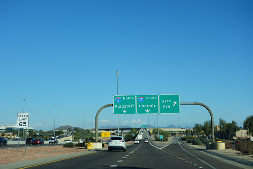 Arizona 101 Loop exit ramp lanes to North and South, toward Flagstaff or Phoenix; copy space