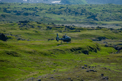 The helicopter brought tourists to the mountain plateau, volcanic magma fields. Gorgeous landscapes of Kamchatka