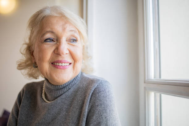istock Happy senior woman 1472545508