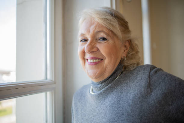 istock Happy senior woman 1472545520