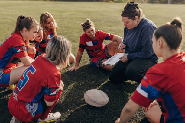 istock Female rugby team with coach 1472545556