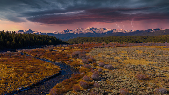 An eerie lightning storm rolls over Colorado’s highest peaks.