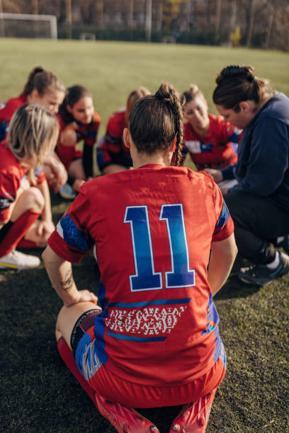 istock Female rugby team with coach 1472545739