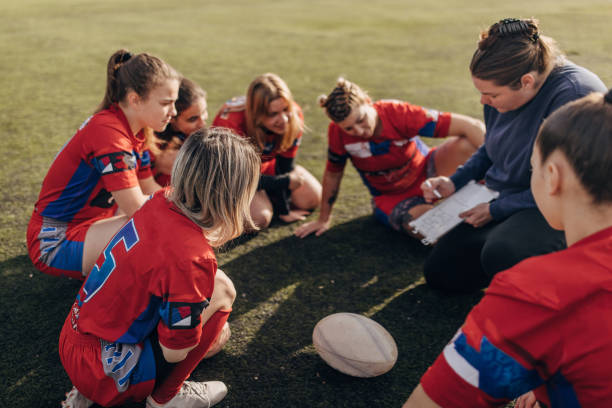 istock Female rugby team with coach 1472545774