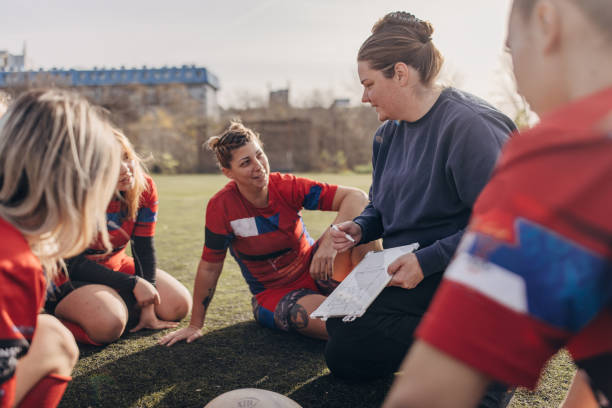 istock Female rugby team with coach 1472545956