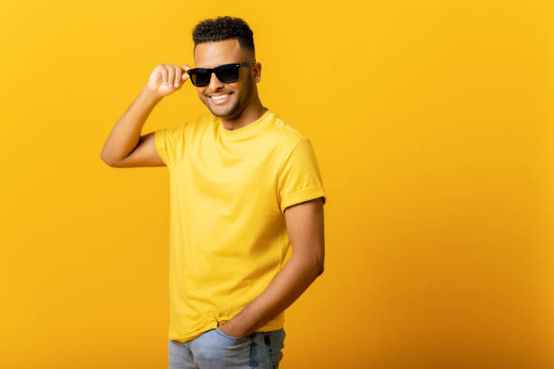 istock Overjoyed Indian man wearing sunglasses 1472547565
