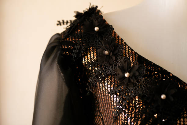 istock Dress decorated with gold sequins or beads on mannequins 1472548145