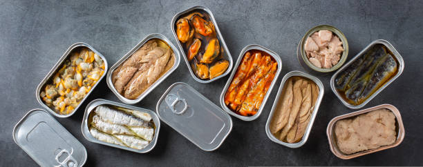 Assortment of Tinned fish, canned food ready for date night stock photo