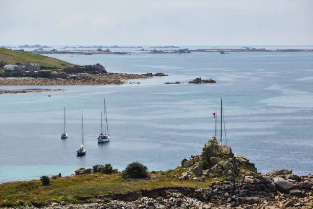 Isles of Scilly, United Kingdom - three sailboats anchor near St. Mary´s harbor