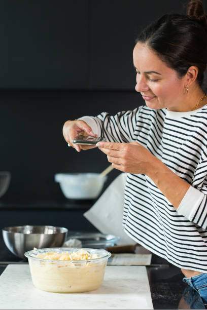 istock Woman making photo for a social media while cooking pie 1472551961