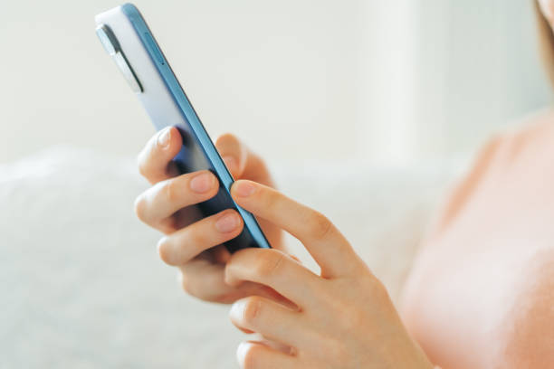 istock A human hands read the news holding her smartphone while sitting 1472554068