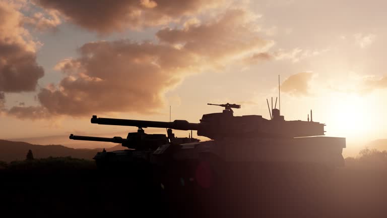 Military tanks silhouettes in a sunset light