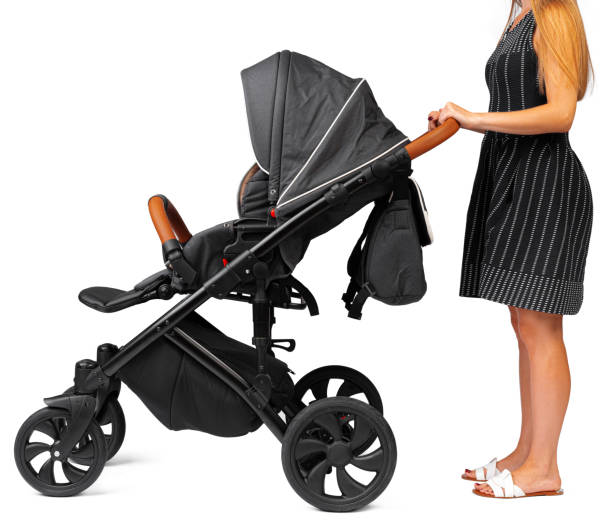 istock mother with a stroller isolated on white background. 1472554598